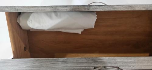 a wooden drawer with a piece of paper in it at Las Julies's Apartment in Arenales