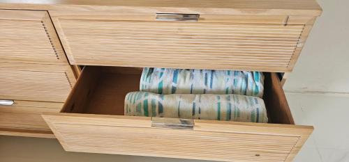 a wooden drawer with a chair in it at Las Julies's Apartment in Arenales
