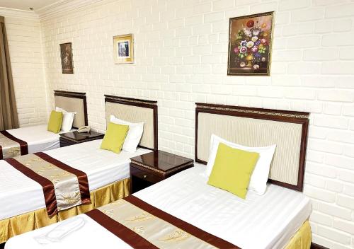 Кровать или кровати в номере Grand Atlas Tashkent