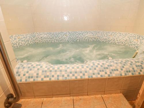 a jacuzziificialificialificialificialificialificialificialificialificialificialificial at Porth House-Beach Front-3 Bed-3 Bath - SPA POOL and SAUNA in Trearddur