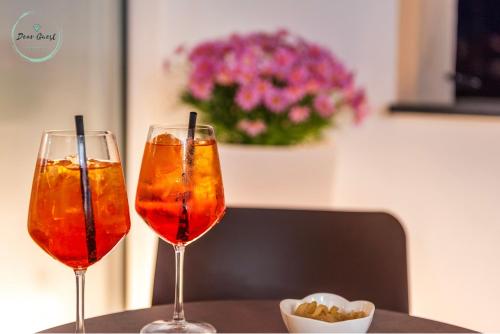 two wine glasses sitting on top of a table at Casa sulle Mura in Loano