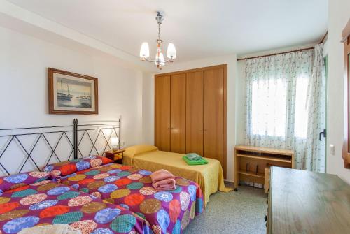 Posteľ alebo postele v izbe v ubytovaní Apartment Patacona Beach 9