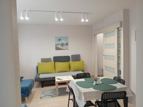 a living room with a couch and a table at Apartament Zacisze in Częstochowa