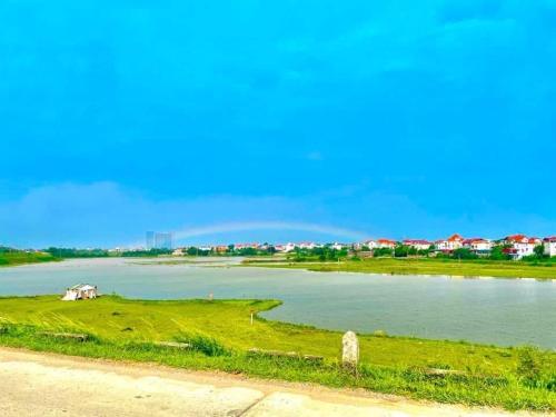 a view of a river with a rainbow in the background at Lee's House in Dong Anh