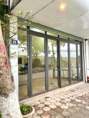 an entrance to a building with sliding glass doors at Lee's House in Dong Anh