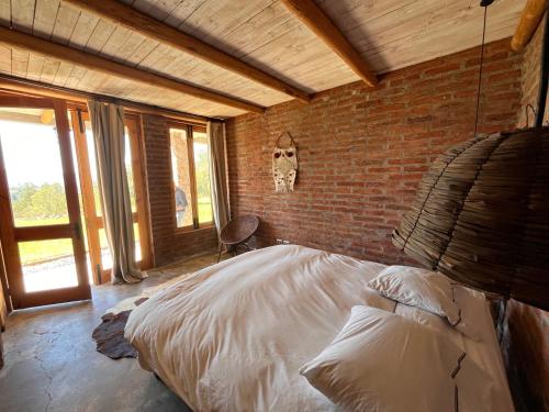 Postel nebo postele na pokoji v ubytování Casa de Campo- François Lurton