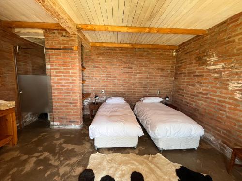 Postel nebo postele na pokoji v ubytování Casa de Campo- François Lurton