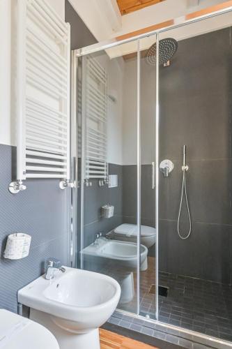 a bathroom with a shower and a toilet and a sink at Ca' del Monica in Manarola