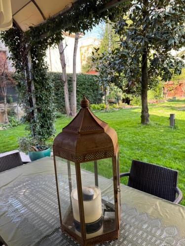 a lantern sitting on top of a table at La tua casa con giardino a 2 passi dal centro in Modena