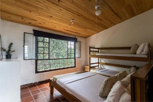 Postel nebo postele na pokoji v ubytování FINCA CON VISTA DESLUMBRANTE - Rinconada, descanso total
