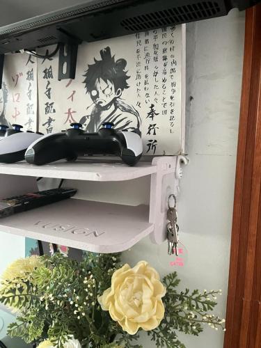 a shelf with a drawing of a person on it at Serenity Escapes by Aj in Manila