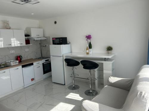 Kuchyň nebo kuchyňský kout v ubytování Amethyst Apartman