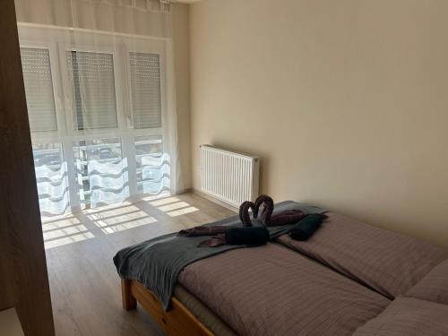 Postel nebo postele na pokoji v ubytování Amethyst Apartman