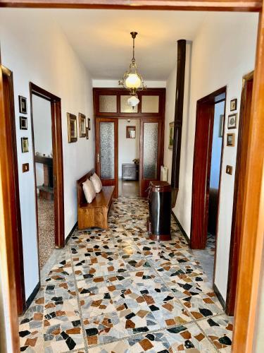 a hallway with a living room with a tile floor at Sosta FONTE DAVIDDI in Santa Fiora