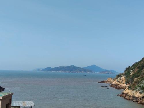 a view of a body of water with mountains at 馥芯莟旅棧 in Nangan Airport