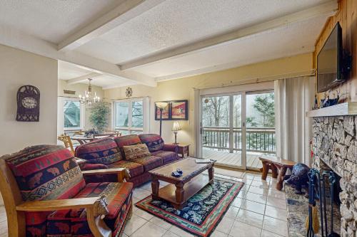 a living room with a couch and a table at Bee Branch 04 in Sugar Mountain