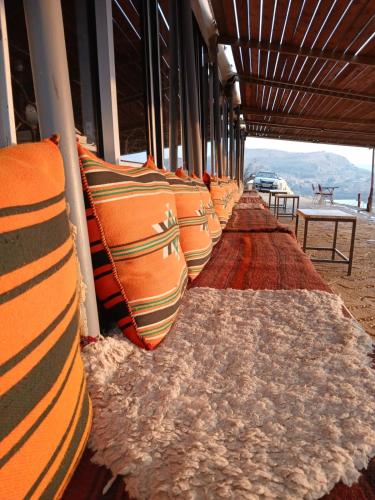 a row of pillows lined up on a train at Dana Village lodge and Camp-Wadi Dana Eco camp in Dana