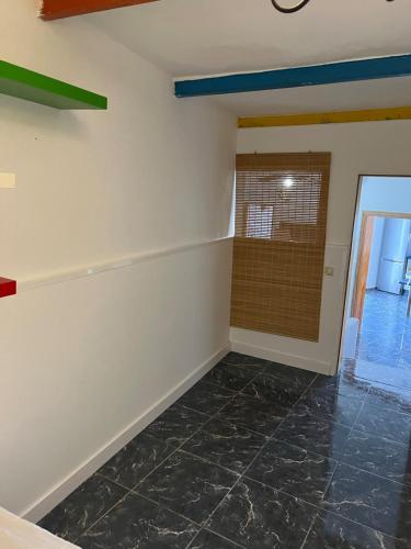an empty room with a door and a tile floor at Claudia - Gortito in Playa Paraiso