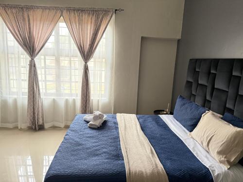 Postel nebo postele na pokoji v ubytování Home Away Nest B&B
