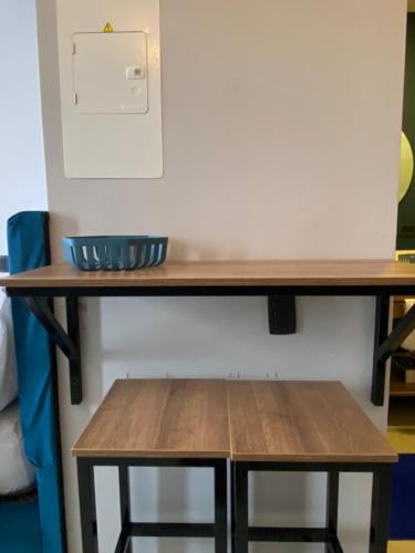 a wooden table with a bench underneath it at Apartamento Central Bogota in Bogotá