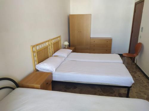 Ένα ή περισσότερα κρεβάτια σε δωμάτιο στο appartamento torre lapillo