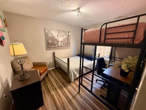 a small room with a bunk bed and a desk at Ferris view horizon in Branson