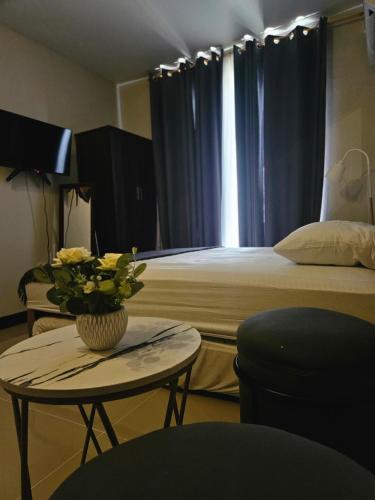 Ένα ή περισσότερα κρεβάτια σε δωμάτιο στο JL Condotel - Near Airport - Oceanview