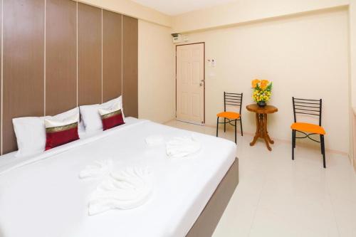 Tempat tidur dalam kamar di Good View Residence