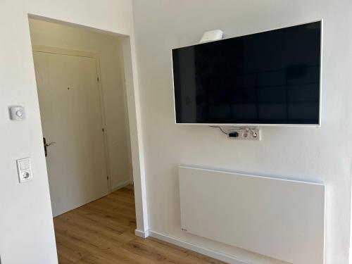 a flat screen tv hanging on a wall at Studio am Hafen in Klagenfurt