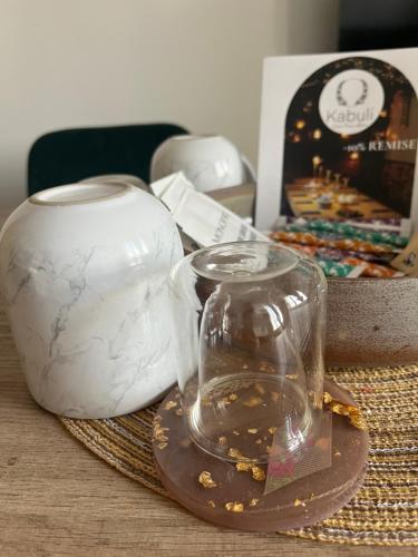 a table with two glass jars and a box at L'escapade verte in Tours