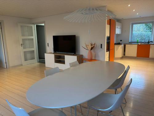 a white table and chairs in a living room at Home in Billund in Billund