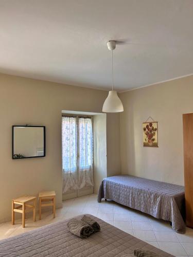Postel nebo postele na pokoji v ubytování TRA MONTI E LAGO