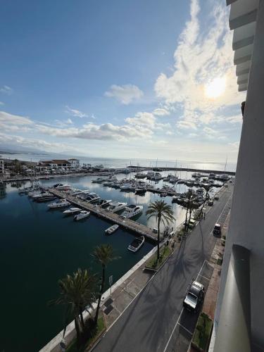 a view of a marina with boats in the water at PlayaDuquesa Apartment SEAVIEW in Manilva