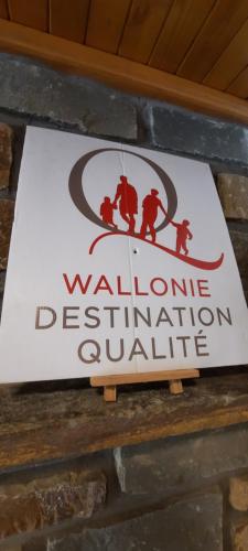 a sign on a brick wall with a waldonne pollution extinguishing sign at " NEW 2025 " Plein Vent 800m entrée Combes circuit Spa Francorchamps in Francorchamps