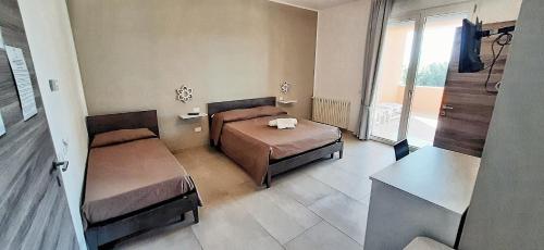 Postel nebo postele na pokoji v ubytování Affittacamere Li Manca