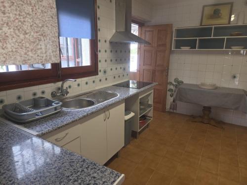 Kuchyň nebo kuchyňský kout v ubytování Villa Maravella