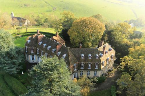 an old house in the middle of a field at Monastere de Brucourt in Brucourt