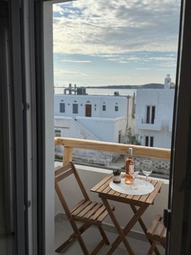 a table and chairs on a balcony with a view at Marjay Boutique in Parikia