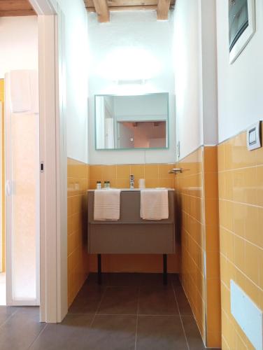 a bathroom with a sink and a mirror at Bes Residence Bergamo Polaresco in Bergamo
