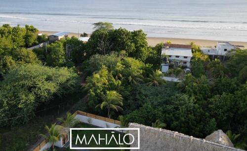 an aerial view of a beach with trees and houses at Mahalo Villa Selva with Private Pool in Popoyo