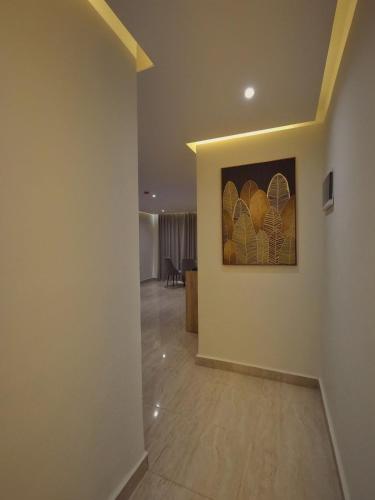 a hallway with a painting on the wall at Grand Season Hotel in Aqaba