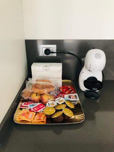 a tray of pastries and other food on a counter at SKY Apartment Pero in Pero