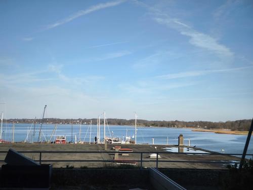 a view of a marina with boats in the water at Schleizauber Ferienwohnung mit Wasserblick und einer großzügigen Terrasse in Schleswig