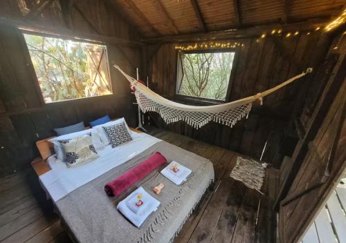 an overhead view of a hammock in a tree house at Ecocentro Brasil - Bangalô Panorâmica in São Pedro