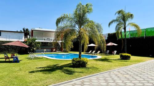 Πισίνα στο ή κοντά στο Hotel Palmas Cocoyoc