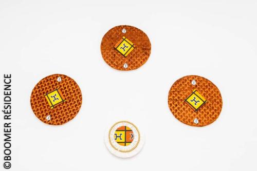 a set of four gingerbread cookies on a white background at Boomer Résidence in Abomey-Calavi