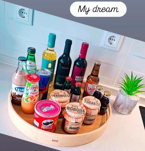 a tray filled with bottles of alcohol on a counter at MY DREAM in Alcains