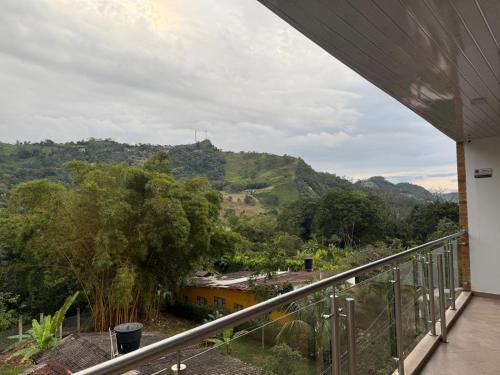 a balcony with a view of a mountain at HOTEL GLASS LAS VEGAS in La Vega