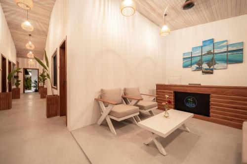 TV a/nebo společenská místnost v ubytování Oasis Dhigurah