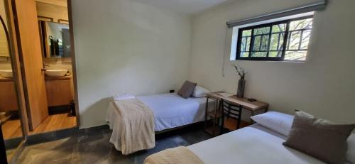 Ein Bett oder Betten in einem Zimmer der Unterkunft Hotel RUTA365